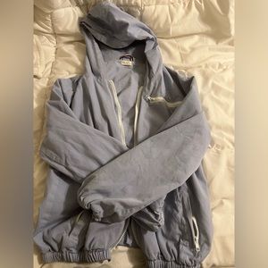 light blue zip up bomber jacket.